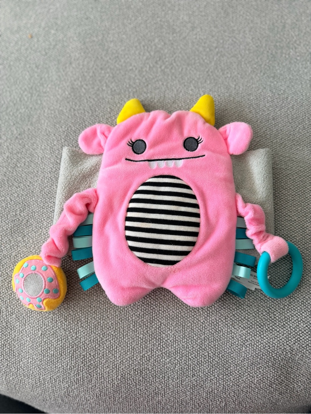 Pink Plush Monster Baby Strap On Tummy Warmer with Teething Ring